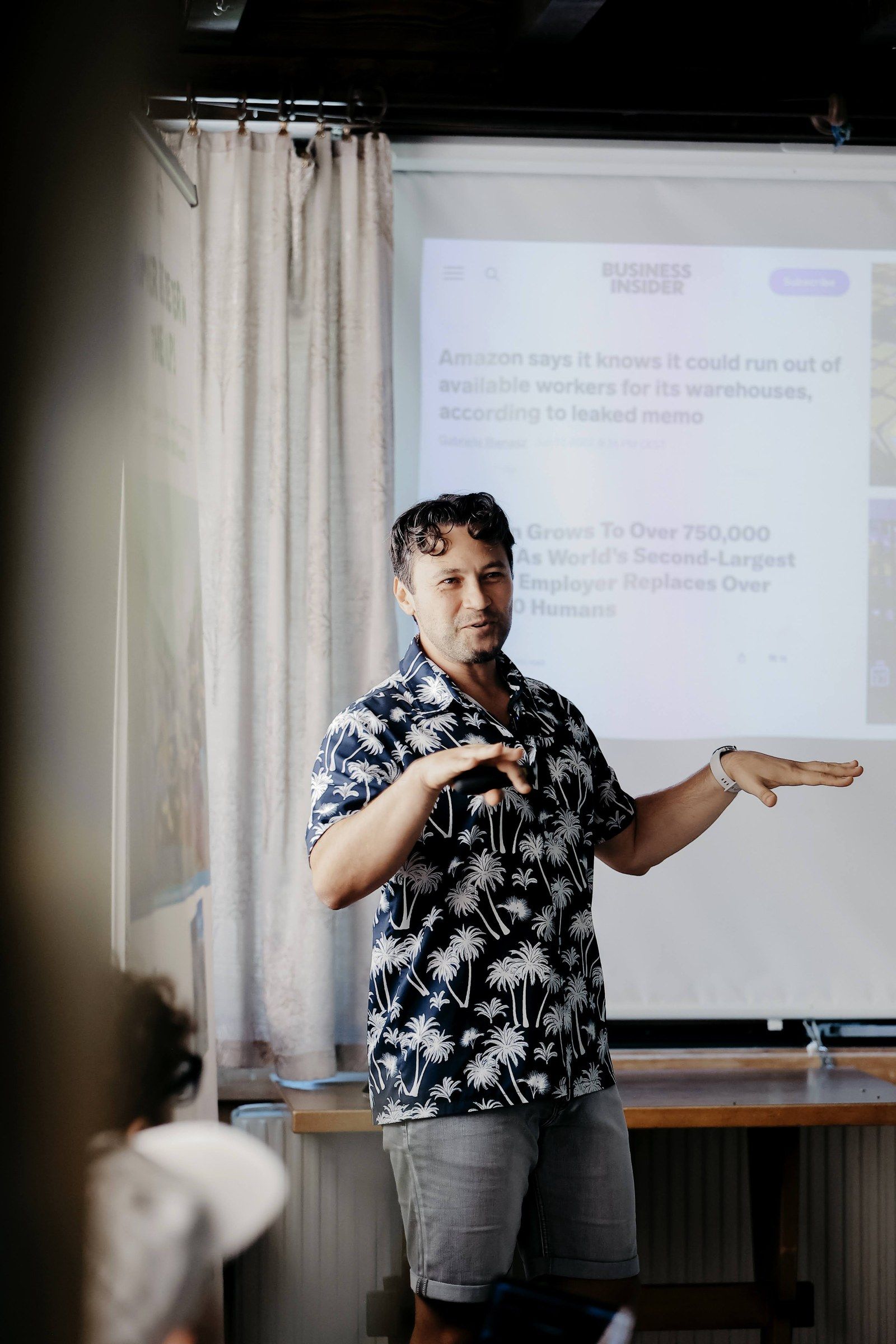Daniel Duma explaining an idea with both hands at Swiss Nomad Fest